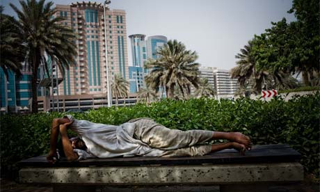 Workers sleep on the street in Dubai. 