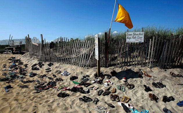 Shoes are left at the entrance to Lucy Vincent Beach in Chilmark, Massachusetts on the island of Martha's Vineyard