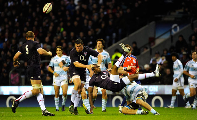 England v Argentina: Ugo Monye is upended after dropping a high ball