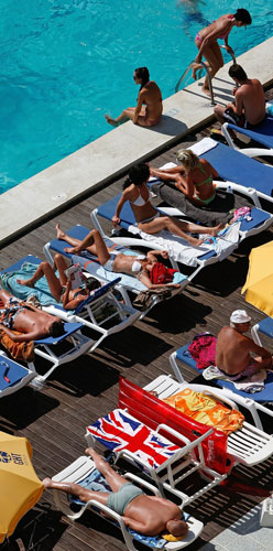 Costa Brava or Bahamas?: A Union Jack towel on a sun lounger in Lloret de Mar, Costa Brava, Spain.