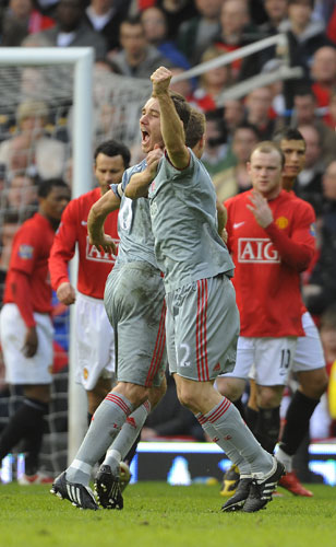 Man Utd v Liverpool: Fabio Aurelio celebrates with Steven Gerrard 