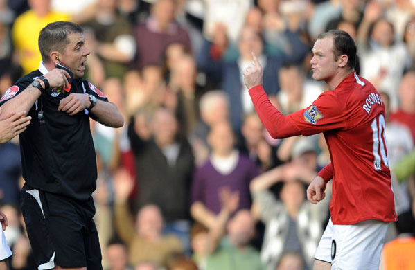 Hot headed Rooney: Rooney gesticulates towards referee after being sent off 