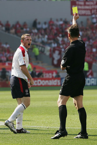 Hot headed Rooney: Rooney is booked for his tackle on goalkeeper Jorg Steil of Switzerland 