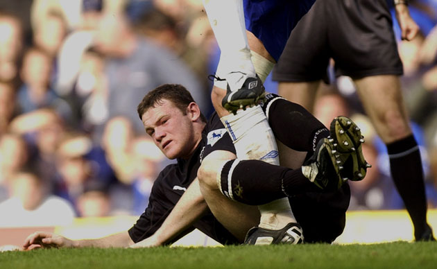 Hot headed Rooney: Rooney makes a reckless tackle on John Terry