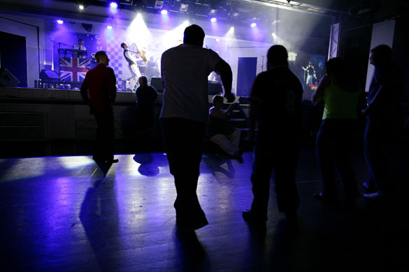 Butlins Bognor Regis: People at the camp dancing at an evening show at Butlins in Bognor Regis