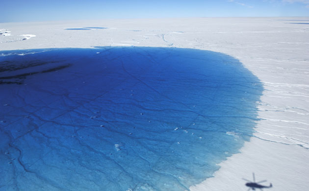 under treat: aerial view on the surface of greenland ice sheet