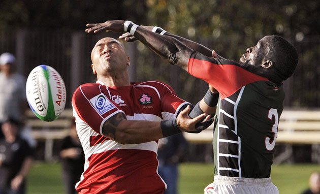 Sport: 24 hours: Kenya and Japan vie for the ball at the International Rugby Sevens