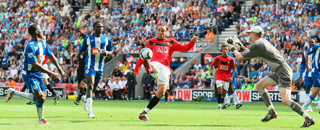 1 champ league draw: Wigan's Chris Kirkland can't stop Dimitar Berbatov scoring United's 2nd 