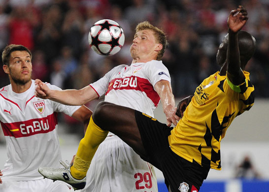 3 champ league draw: Stuttgart's Pavel Pogreb keeps the ball away from Timisoara's Dare Nibombe