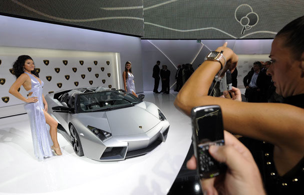 Frankfurt motor show: Hostesses pose beside a Lamborghini Reventon