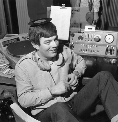 Radio 1 breakfast DJs: Tony Blackburn DJ balancing a single on his head