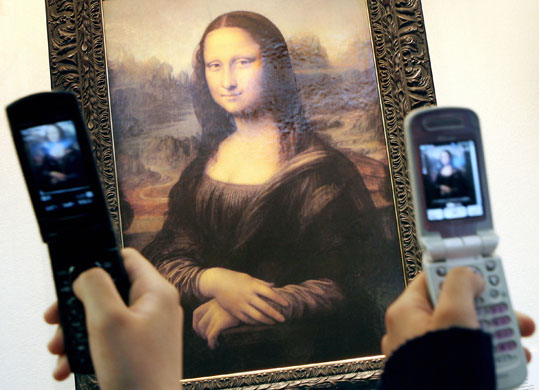 Rise of the camera-phone: A copy of the Mona Lisa photographed 