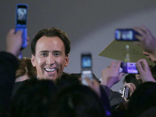 Rise of the camera-phone: Actor Nicolas Cage greets fans