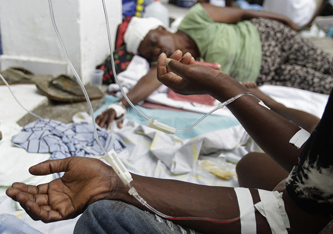 Cholera in Haiti: People receive serum at the St Nicholas hospital in Saint Marc, Haiti