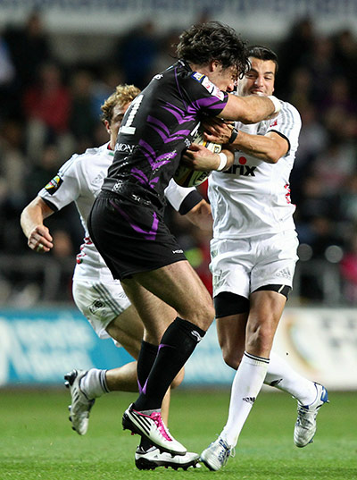 Heineken preview: Mike Phillips of Ospreys is tackled by Riccardo Bocchino of Aironi Rugby