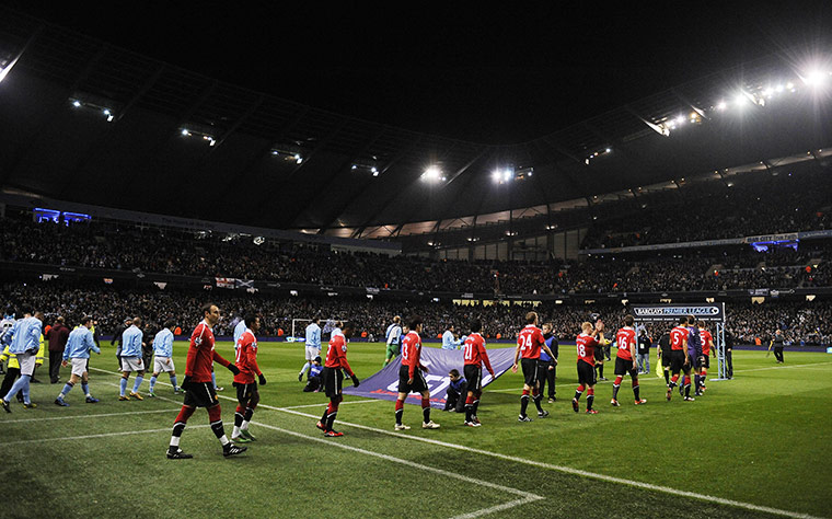 Man City v Man Utd: Manchester City and Manchester United players walk out onto the pitch