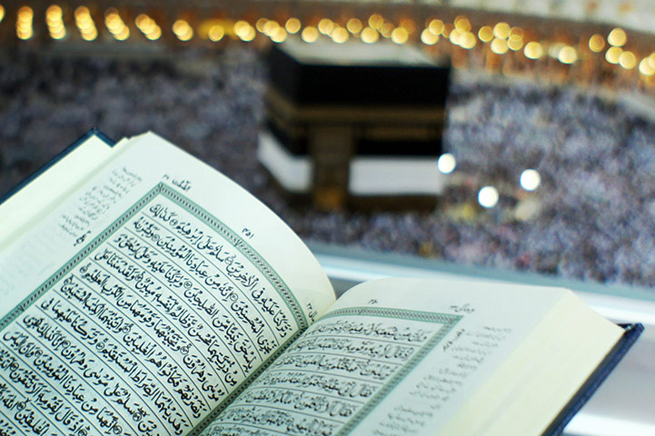 Hajj In Mecca: A Muslim pilgrim reads the Koran at the Grand Mosque in Mecca