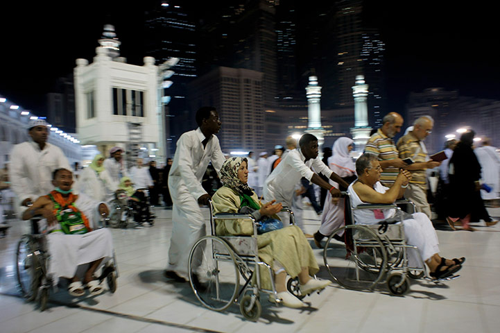 Hajj In Mecca: Elderly and walk-impaired Muslim pilgrims circle the Kaaba