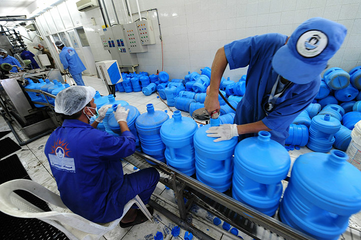 Hajj In Mecca: Saudi workers clean returned empty carboys of 'zamzam' water