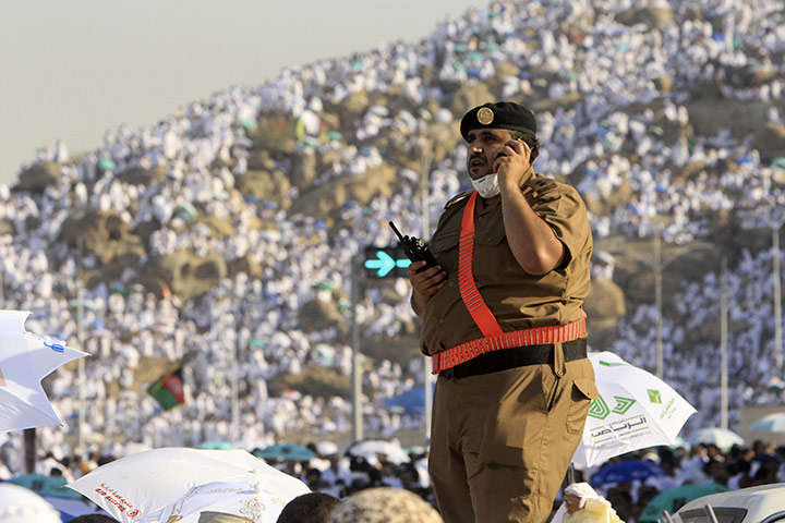 Hajj in Mecca: A member of Saudi security forces stands guard on the plains of Arafat
