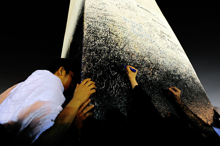 Hajj Pilgimage: Muslim pilgrims leave an autograph at Mount Arafat