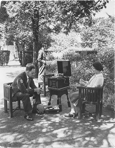 75th Anniversary of RNIB Talking Books: People listen to a gramophone player in their garden in the thirties