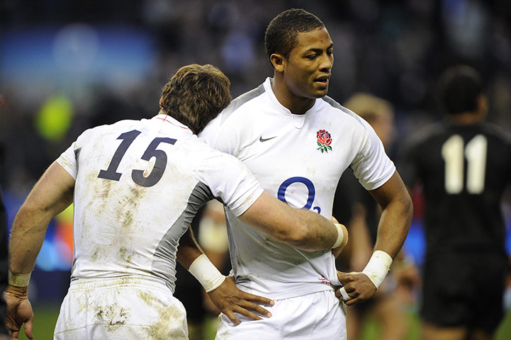 England v All Blacks: Ben Foden envelops a tender arm around a disappointed Delon Armitage 