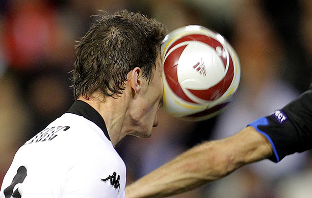 Europa League: Valencia forward Nikola Zigic heads the ball