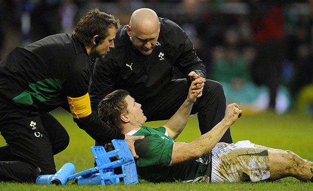England v Ireland: A dazed Brian O'Driscoll has to be carried off injured 