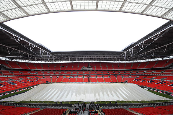 Carling Cup Final: 12:00 The rain covers are out to protect the pitch from the heavy rain