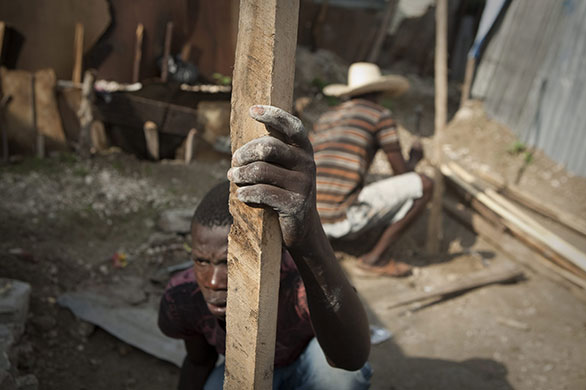 24 hours in pictures: rebuilding efforts in Haiti
