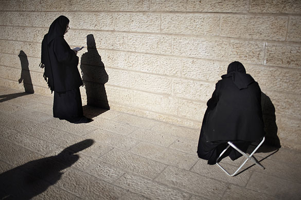 24 hours in pictures: Qasr al-Yahud, West Bank: Christian Orthodox nuns pray