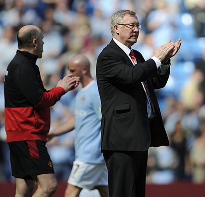 City v United: Alex Ferguson applauds his players off the pitch