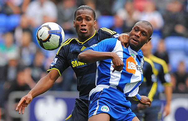 Title race gallery: Chelsea's Didier Drogba battles with Wigan's Emmerson Boyce 