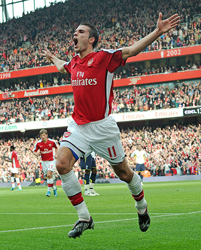 Title race gallery: Arsenal's Robin van Persie celebrates after scoring against Tottenham