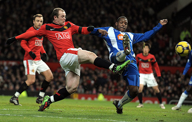 Title race gallery: Manchester United's Wayne Rooney scores the 1st in their 5-0 win over Wigan