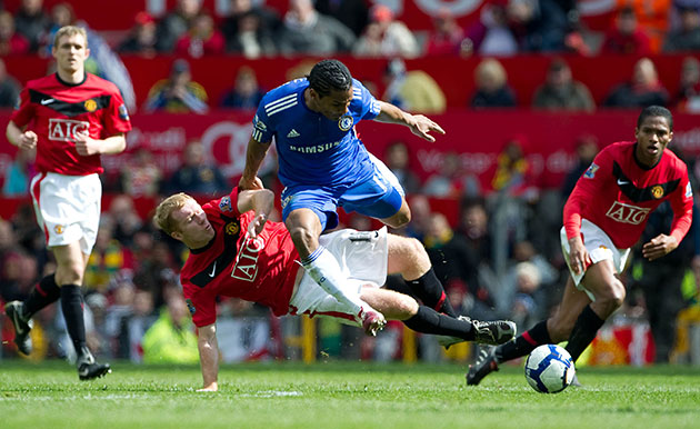 Title race gallery: Florent Malouda rides a rough tackle from Paul Scholes
