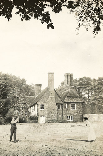 Hancox House: Norman and Milicent playing tennis on the lawn at Hancox 