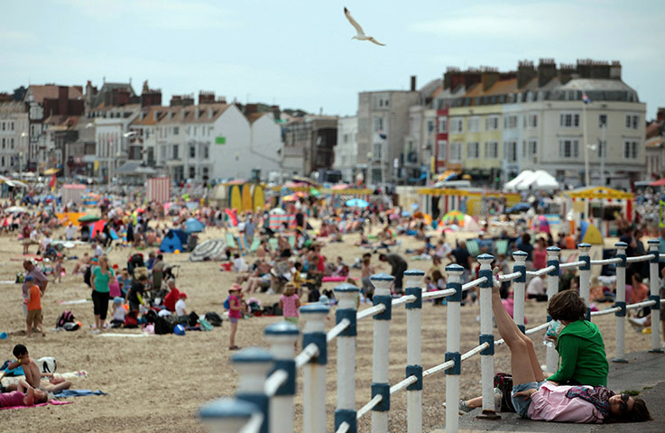 Weymouth: People enjoy the summer weather on the beach in Weymouth