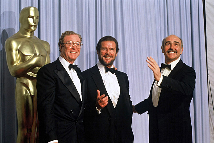 With fellow Brits Michael Caine and Roger Moore at the Oscars in Los Angeles in 1989.