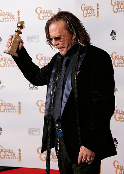 10 best: acceptances: Actor Mickey Rourke holds his award for Best Performance by