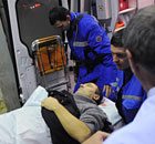 Medical staff wheel a victim of the bomb explosion at Domodedovo airport from an emergency vehicle
