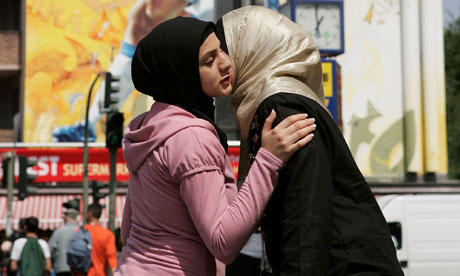 Two-Muslim-women-greet-ea-007.jpg