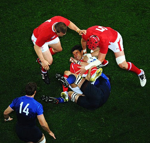 Wales v France RWC Semi: Mike Phillips is tackled to the ground 