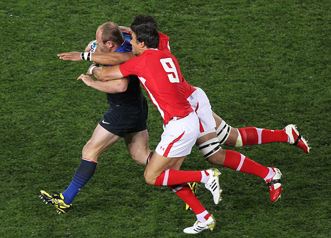 Wales v France RWC Semi: France's William Servat is tackled by Wales' Mike Phillips 