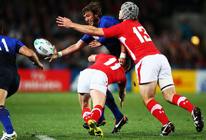 Wales v France RWC Semi: Maxime Medard is tackled by Alexis Palisson 