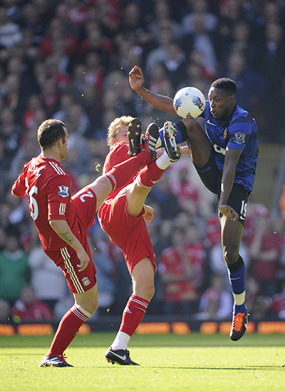 Liverpool v United: Danny Wellbeck vies with Charlie Adam and Lucas Leiva