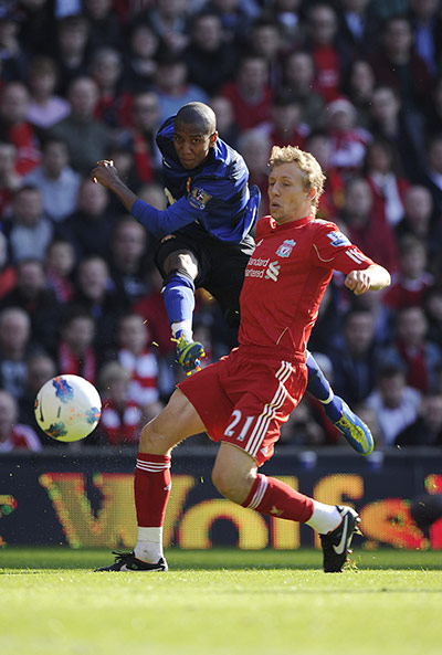 Liverpool v United: Ashley Young fires a shot past Lucas