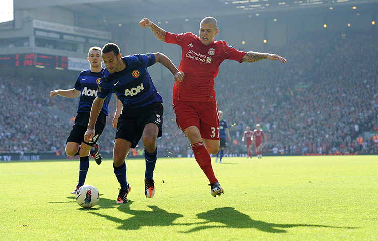 Liverpool v United: Ferdinand and Skrtel battle it out in the early afternoon sun