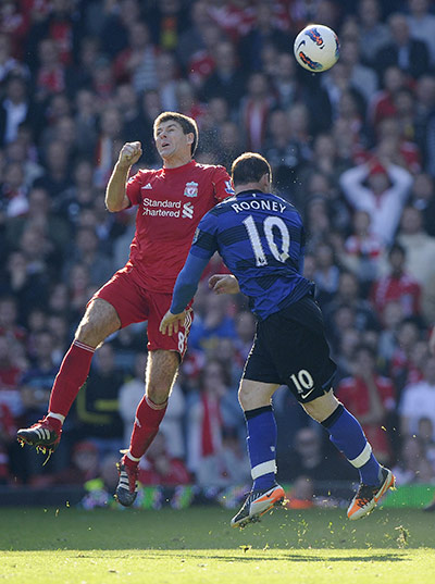 Liverpool v United: Steven Gerrard and Wayne Rooney challenge for a header